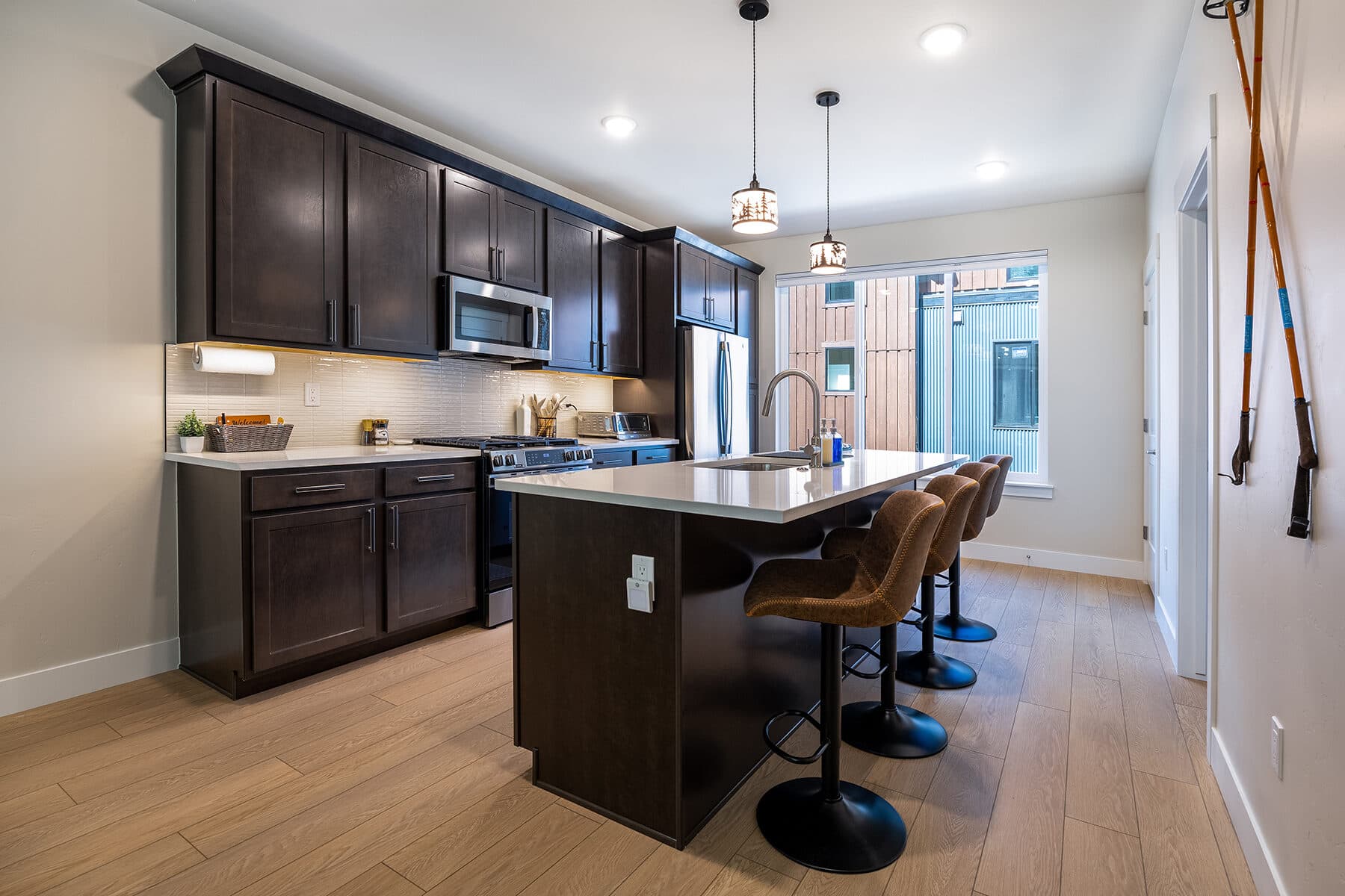 Modern kitchen with a large island and bar seating at the Après Haus