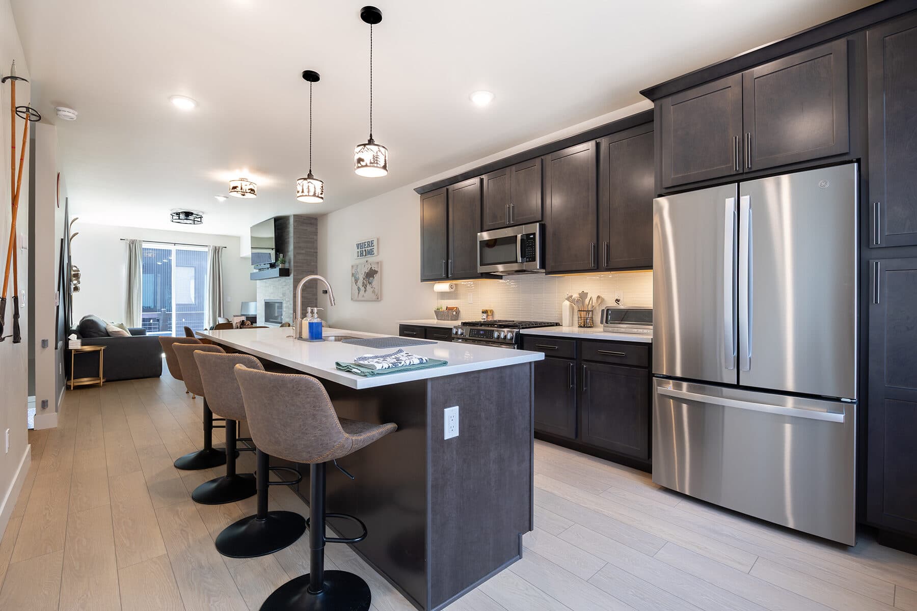 Modern kitchen with a large waterfall island and bar seating
