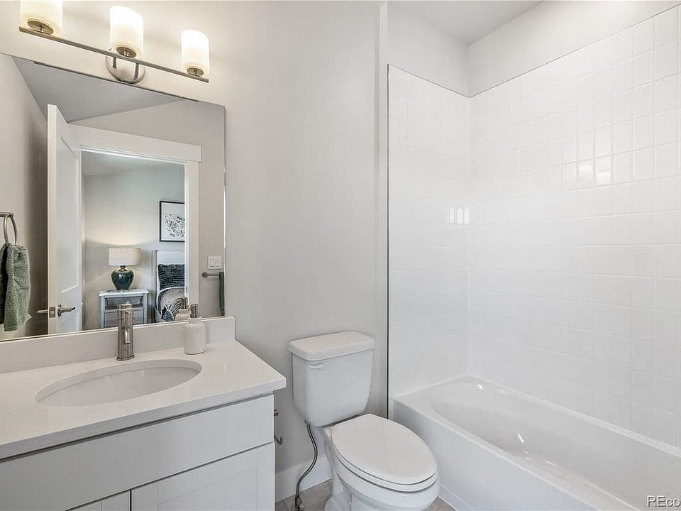 Second bathroom with tub and shower combo
