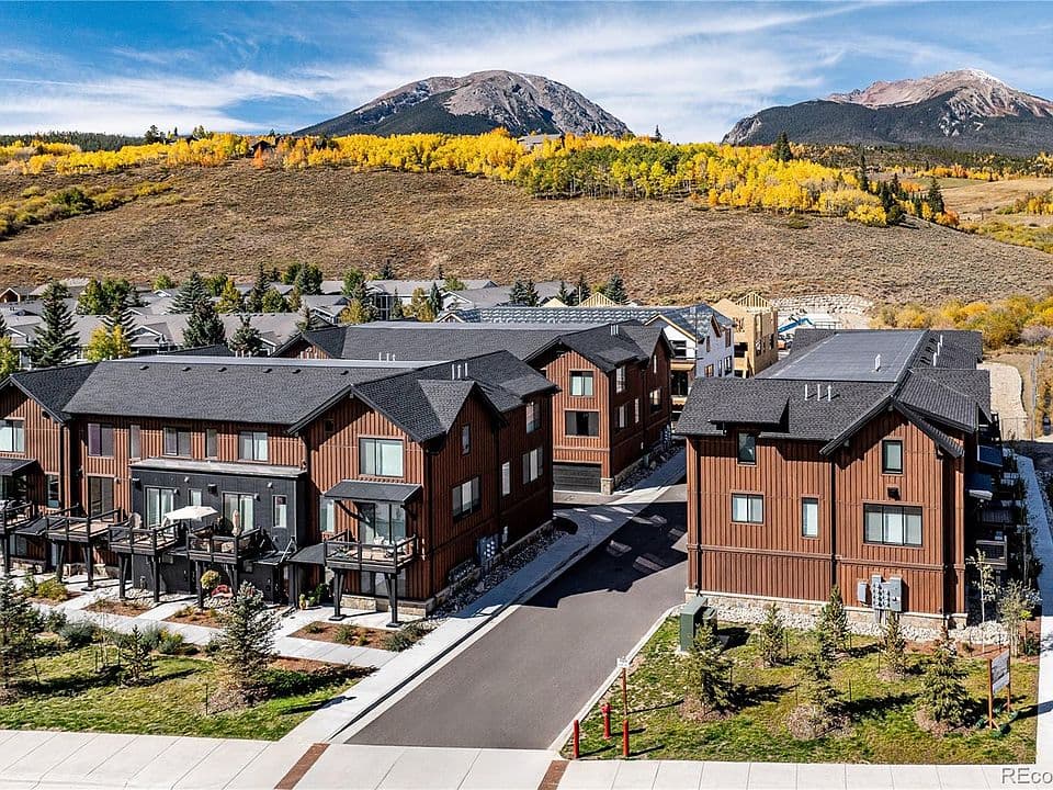 Blue River Haus exterior with mountain backdrop in fall